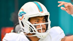 Tua Tagovailoa playing NFL American football for the Miami Dolphins