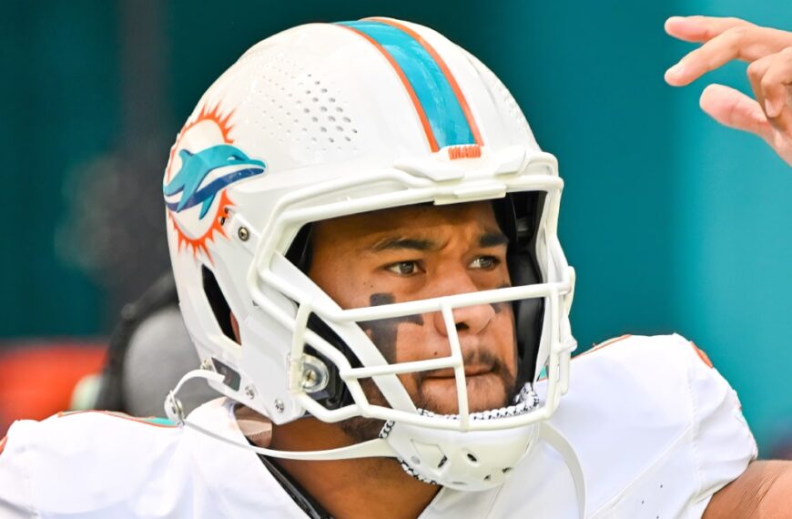 Tua Tagovailoa playing NFL American football for the Miami Dolphins