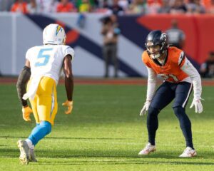 Denver Broncos cornerback Riley Moss defending Los Angeles Chargers wide reciever Joshua Palmer