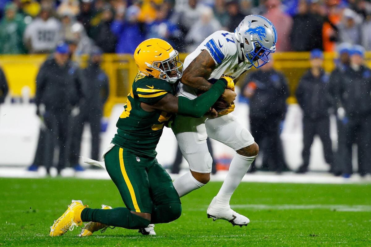 Green Bay Packers linebacker Edgerrin Cooper tackles a member of the Detroit Lions.