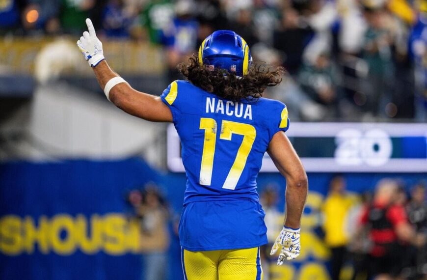 Los Angeles Rams wide receiver Puka Nacua celebrates a play by pointing his index finger in the air.