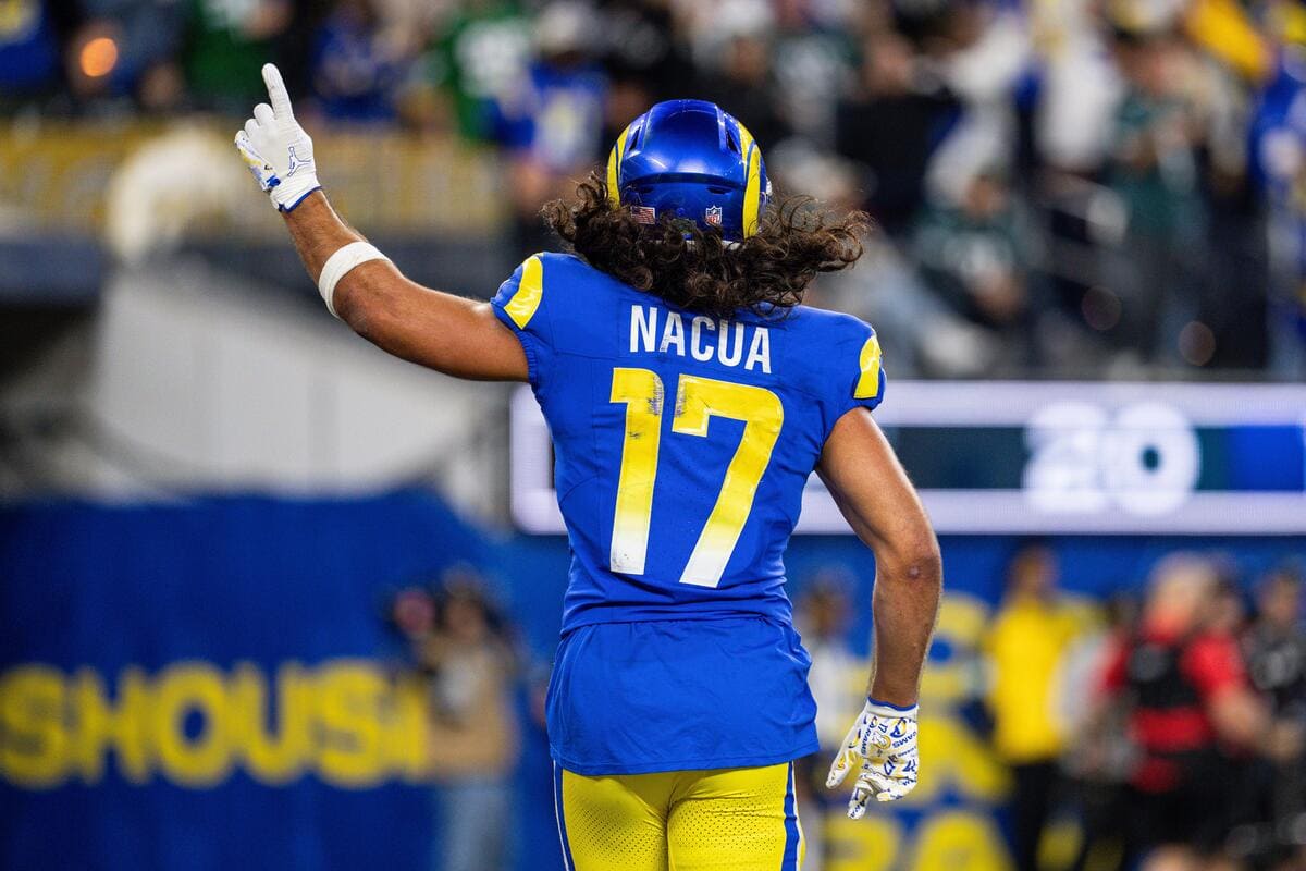 Los Angeles Rams wide receiver Puka Nacua celebrates a play by pointing his index finger in the air.