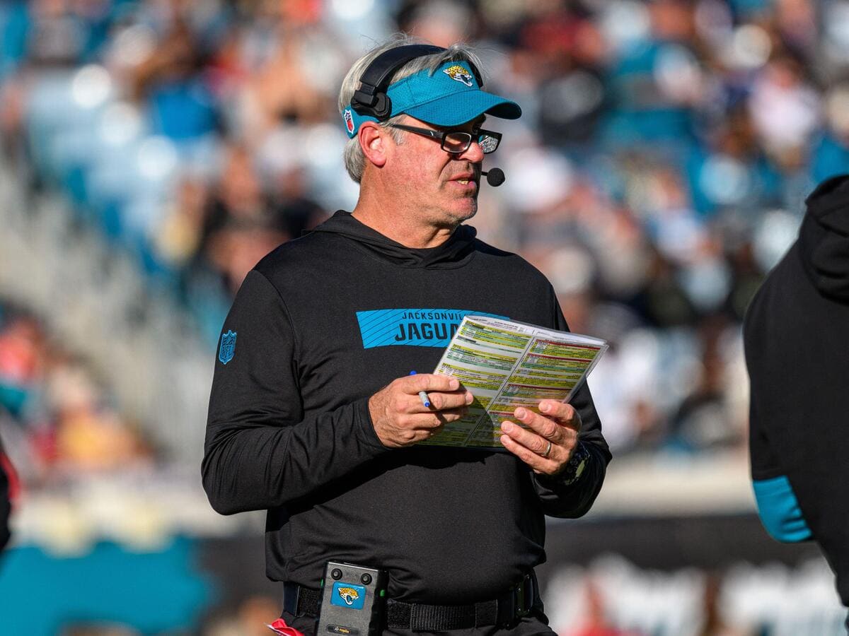 Jacksonville Jaguars head coach Doug Pederson holding a playsheet.