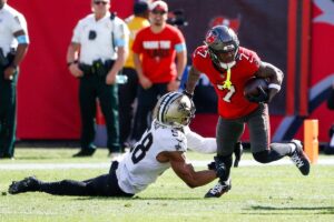 Tampa Bay Buccaneers running back Bucky Irving sheds a tackle.