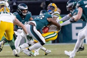 Green Bay Packers kick returner Keisean Nixon fumbles the football.