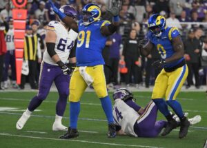 Los Angeles Rams defensive lineman Kobie Turner celebrates a sack.