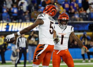 Cincinnati Bengals wide receivers Ja'Marr Chase and Tee Higgins celebrate a good play.