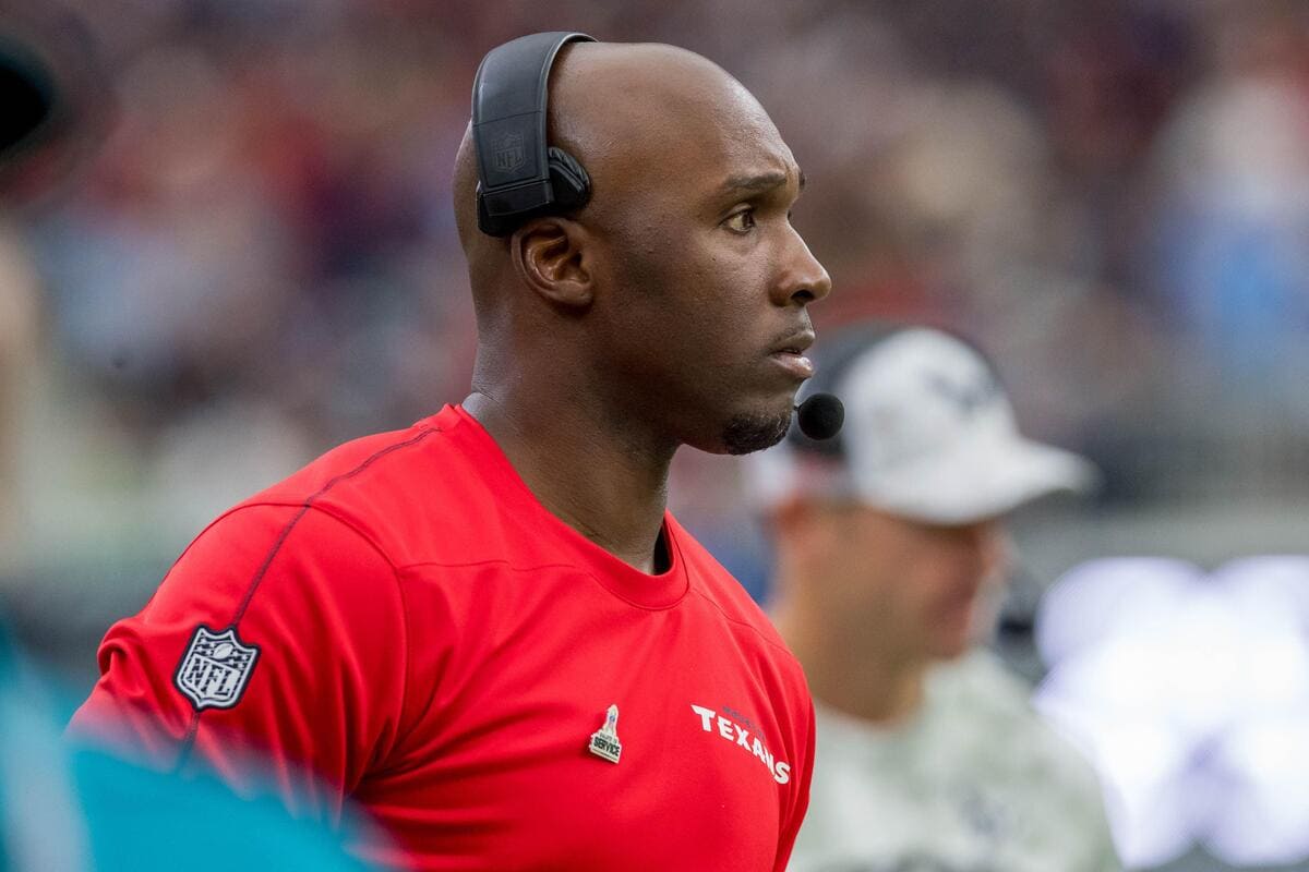 Houston Texans head coach DeMeco Ryans looks at a football field.