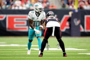 Miami Dolphins wide receiver Tyreek Hill lined up across from a defender.