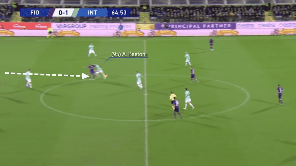However Bastoni reads the play and is in to win possession for his team.