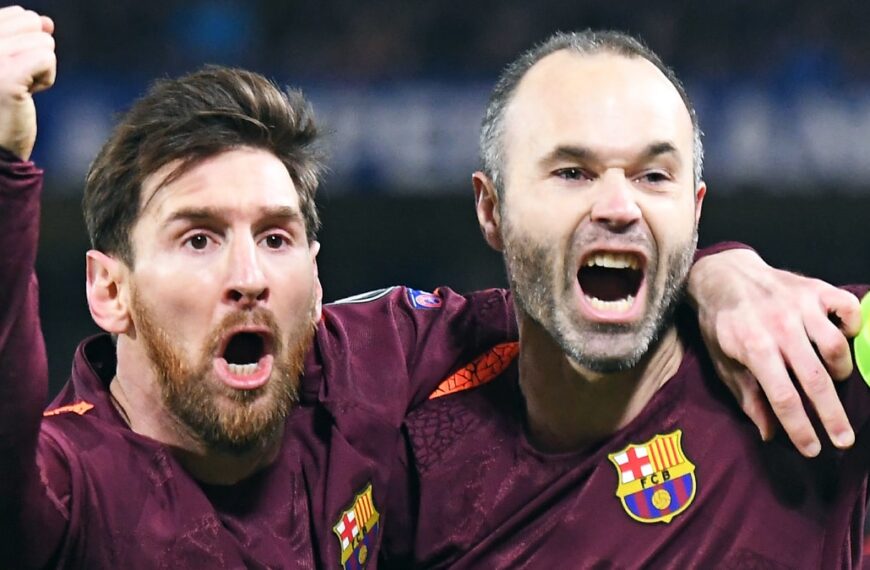 Lionel Messi and Andres Iniesta playing football for Barcelona