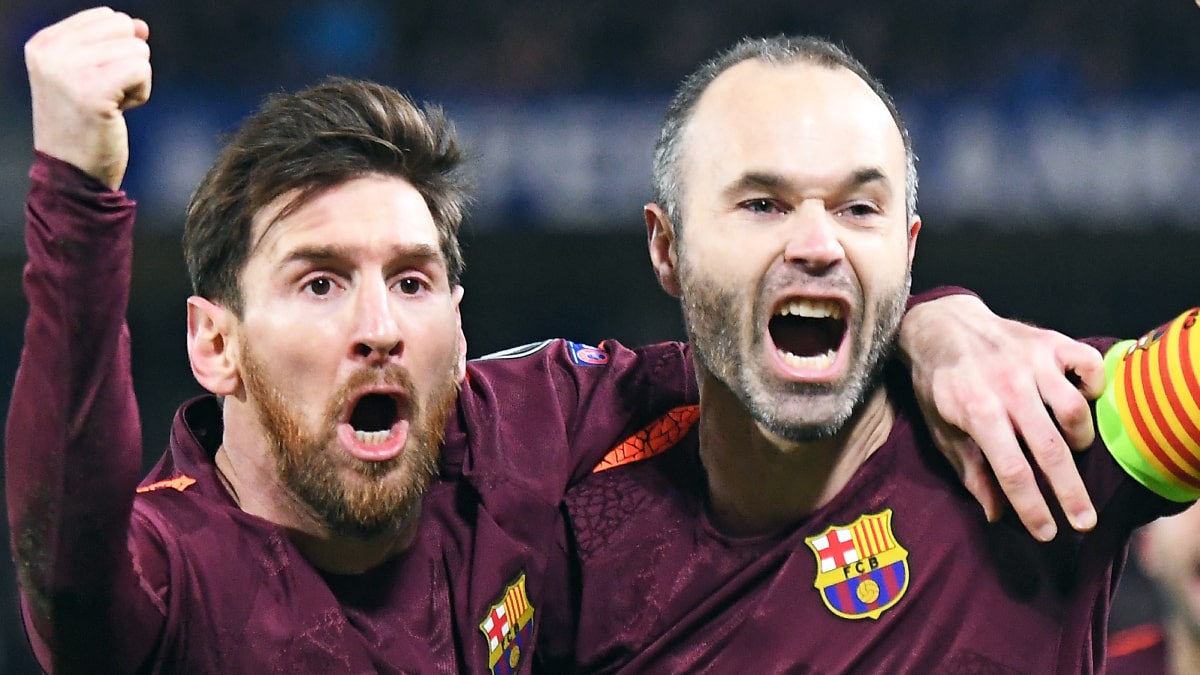 Lionel Messi and Andres Iniesta playing football for Barcelona