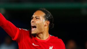 Virgil van Dijk playing football for Liverpool