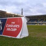 A photo of The Den stadium home of Millwall Football Club with an FA Cup sign visible